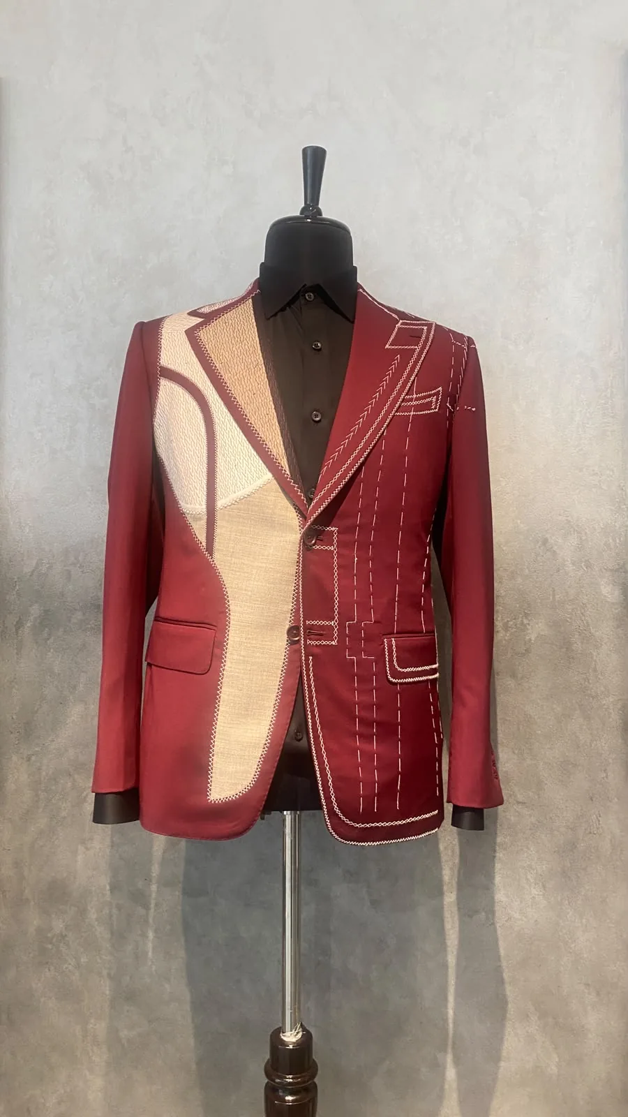 Burgundy bespoke jacket with contrasting cream panels and visible stitch detailing, made in-house by The Man Project