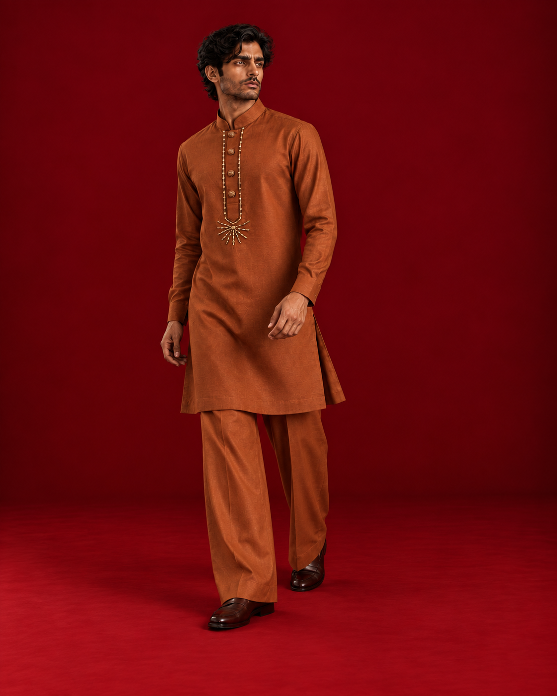 Rust kurta with sunburst neckline detail